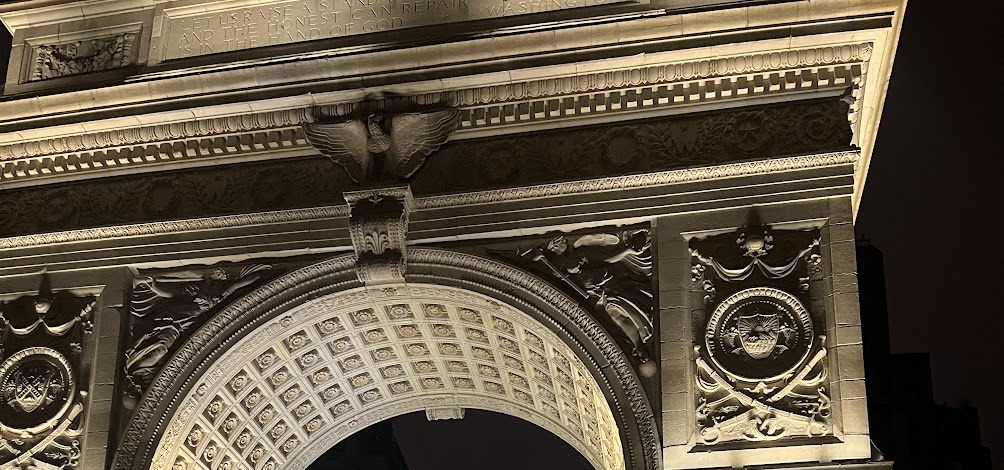 The top of the Washington Square Arch lit up at night, Greenwich Village, New York City